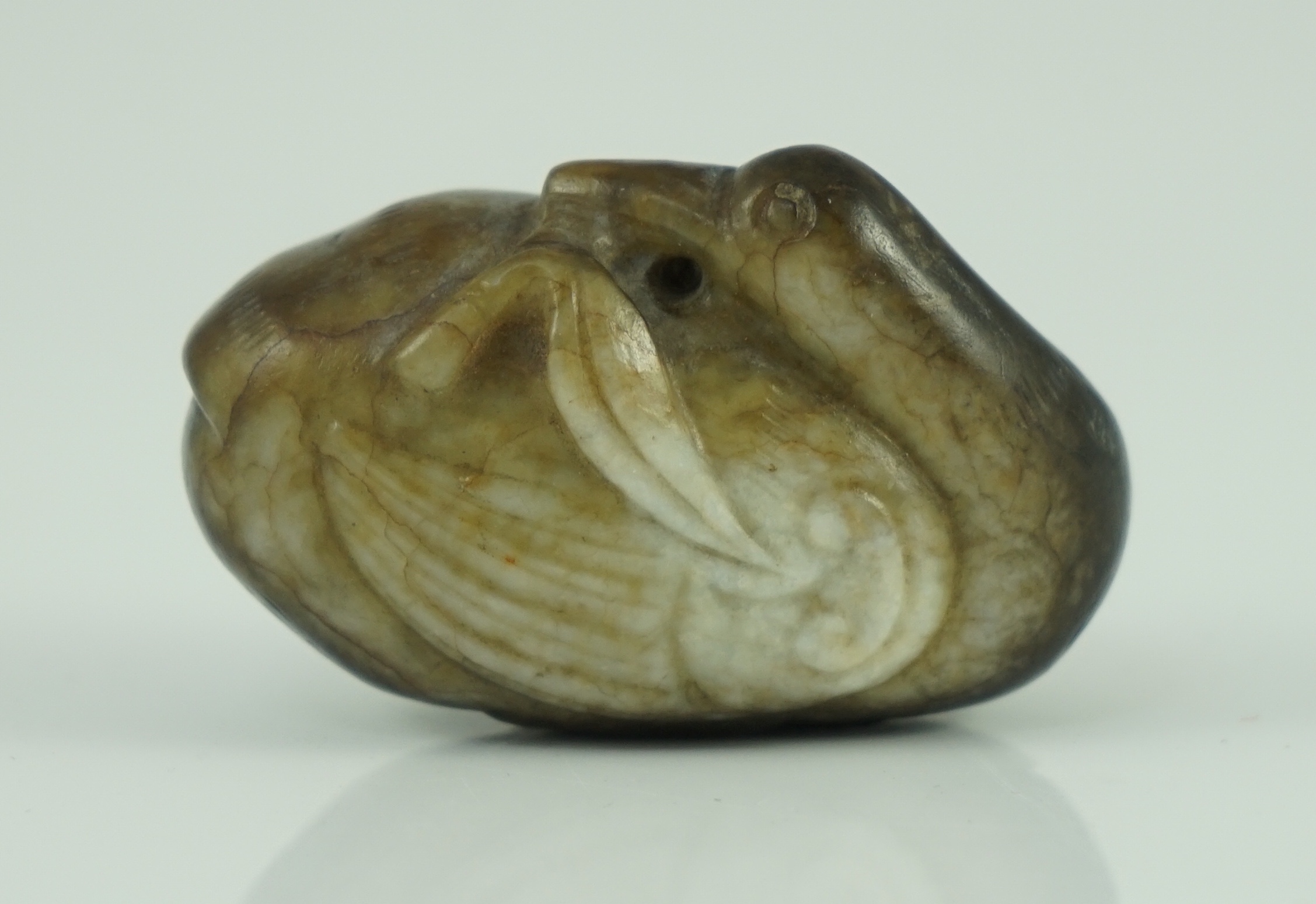 A Chinese white and black jade 'duck' pebble carving, Song dynasty or later 4.8 cm long